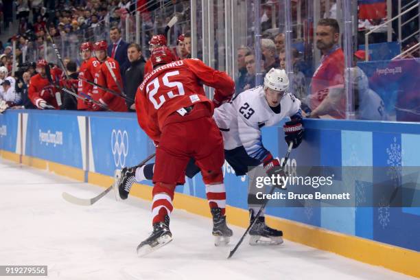 Troy Terry of the United States goes for the puck against Mikhail Grigorenko of Olympic Athlete from Russia during the Men's Ice Hockey Preliminary...