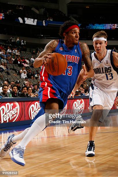 Deron Washington of the Detroit Pistons drives against Matt Carroll of the Dallas Mavericks during a preseason game at the American Airlines Center...