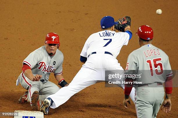 Carlos Ruiz of the Philadelphia Phillies gets doubled out at first base by James Loney of the Los Angeles Dodgers in the eighth inning in Game One of...