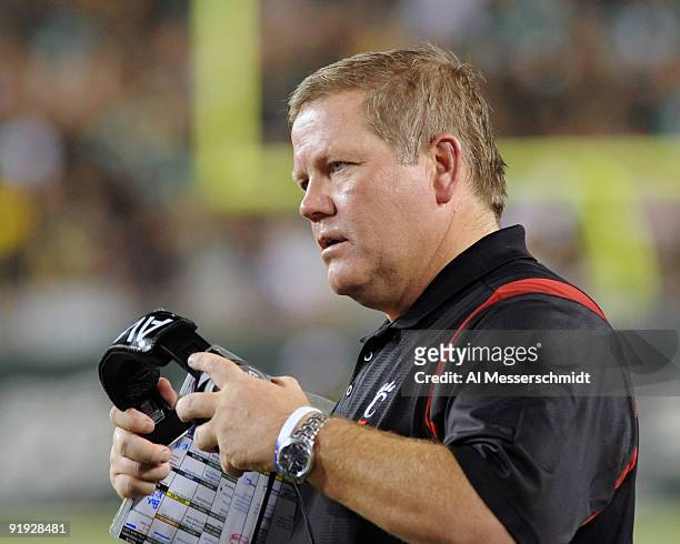 Coach Brian Kelly of the Cincinnati Bearcats directs play against the University of South Florida Bulls October 15, 2009 at Raymond James Stadium in...