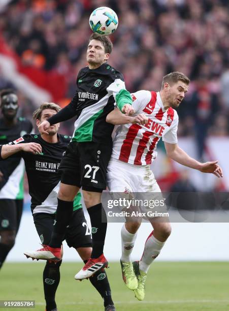 Pirmin Schwegler of Hannover jumps for a header with Simon Terodde of Koeln during the Bundesliga match between 1. FC Koeln and Hannover 96 at...