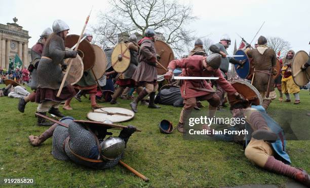 Re-enactors representing the rival armies of the Vikings and Anglo-Saxons skirmish in York during the Jorvik Viking Festival on February 17, 2018 in...