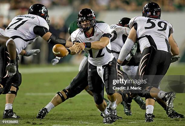 Quarterback Zach Collaros of the Cincinnati Bearcats pitches the ball against the South Florida Bulls during the game at Raymond James Stadium on...