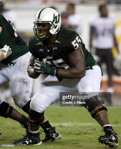 Offensive lineman Jeremiah Warren of the South Florida Bulls blocks against the Cincinnati Bearcats during the game at Raymond James Stadium on...