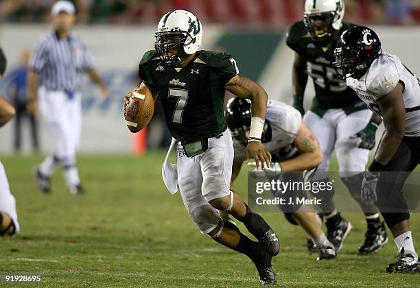 Quarterback B.J. Daniels of the South Florida Bulls runs the ball against the Cincinnati Bearcats during the game at Raymond James Stadium on October...