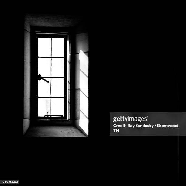 casement window with sunlight in black & white - brentwood tennessee stock pictures, royalty-free photos & images