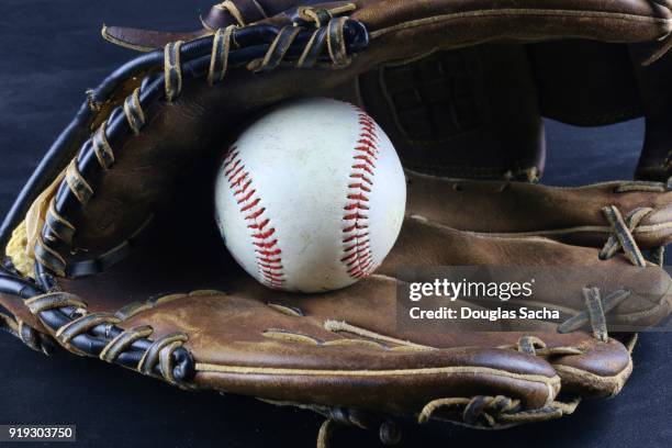 baseball leather glove with hard ball - baseball glove texture stock pictures, royalty-free photos & images