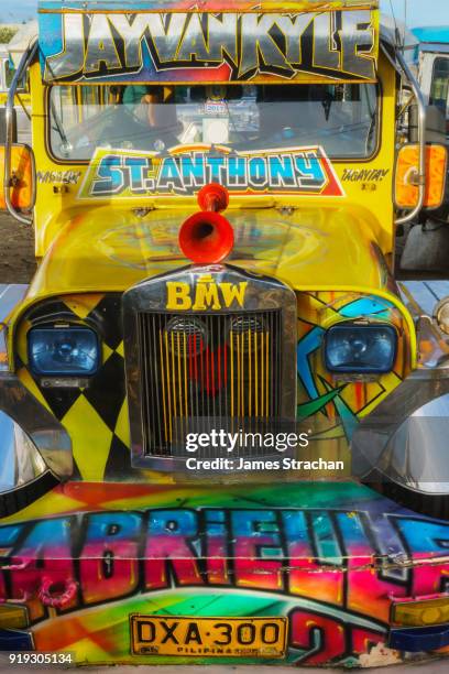 front of a jeepney, the most popular means of public transport in the philippines. their kitsch decorations are a ubiquitous symbol of popular art, tagaytay, luzon island, philippines - tagaytay stock pictures, royalty-free photos & images