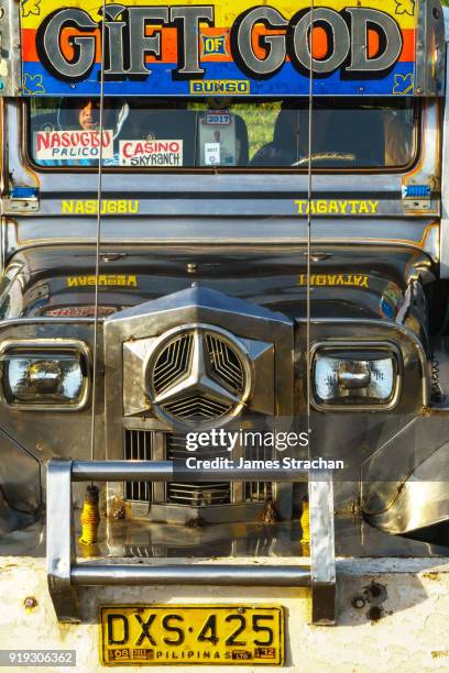 front of a jeepney, the most popular means of public transport in the philippines. their kitsch decorations are a ubiquitous symbol of popular art, tagaytay, luzon island, philippines - tagaytay stock pictures, royalty-free photos & images