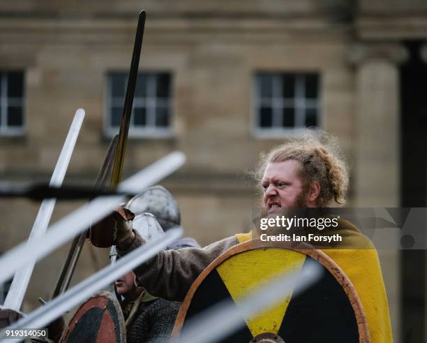 Re-enactors representing the rival armies of the Vikings and Anglo-Saxons skirmish in York during the Jorvik Viking Festival on February 17, 2018 in...