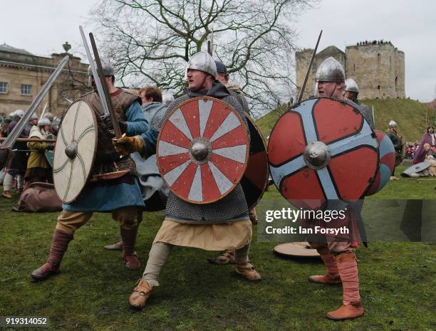 Re-enactors representing the rival armies of the Vikings and Anglo-Saxons skirmish in York during the Jorvik Viking Festival on February 17, 2018 in...