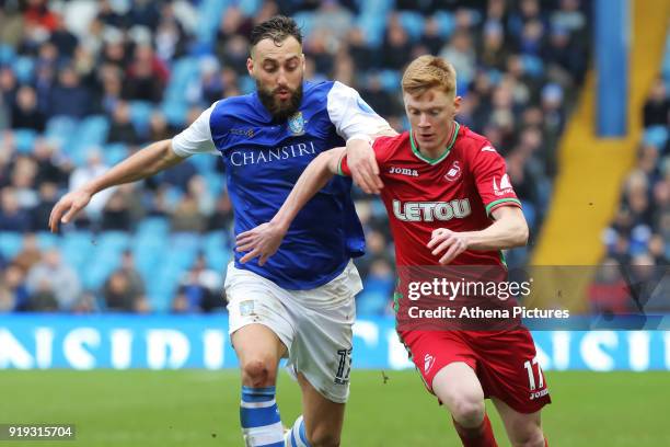 Sam Clucas of Swansea City closely followed by Atdhe Nuhiu of Sheffield Wednesday during The Emirates FA Cup Fifth Round match between Sheffield...