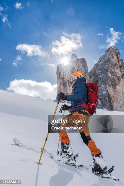 young man ski touring in dolomiti, italia - sci alpinismo foto e immagini stock