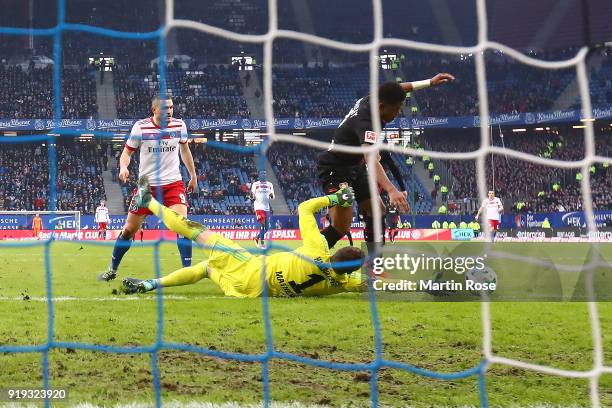 Leon Bailey of Bayer Leverkusen scores a goal past goalkeeper Christian Mathenia of Hamburg during the Bundesliga match between Hamburger SV and...