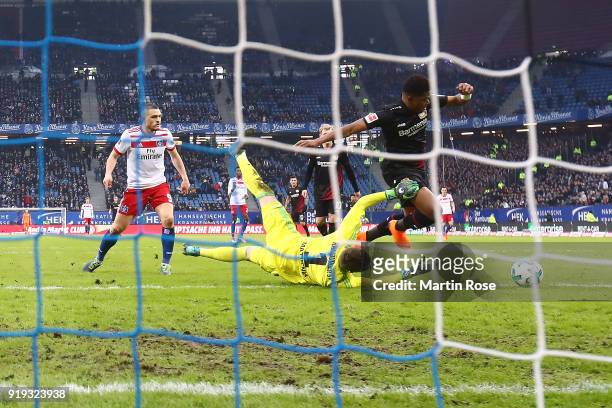 Leon Bailey of Bayer Leverkusen scores a goal past goalkeeper Christian Mathenia of Hamburg during the Bundesliga match between Hamburger SV and...