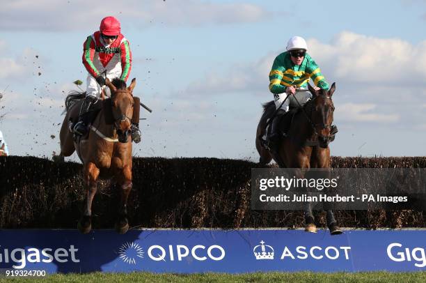 Regal Encore and Richie Mclernon lead Minella Daddy and Sean Bowen over the last fence before going on to win The Keltbray Swinley Chase run during...