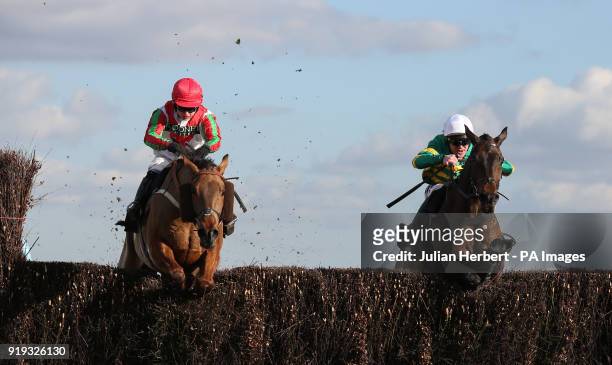 Regal Encore and Richie Mclernon lead Minella Daddy and Sean Bowen over the last fence before going on to win The Keltbray Swinley Chase run during...