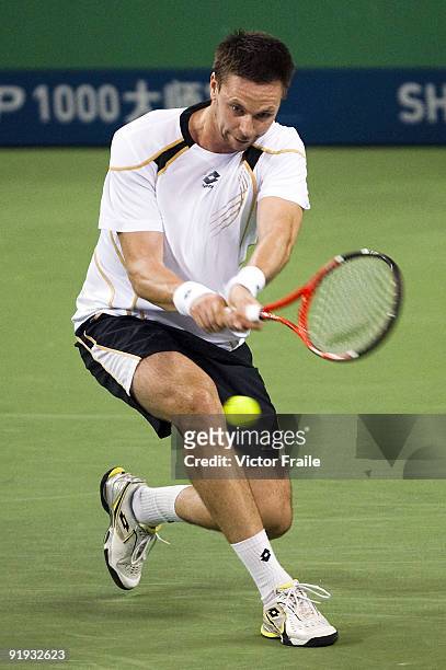 Robin Soderling of Sweden returns a shot to Feliciano Lopez of Spain during day six of 2009 Shanghai ATP Masters 1000 at Qi Zhong Tennis Centre on...