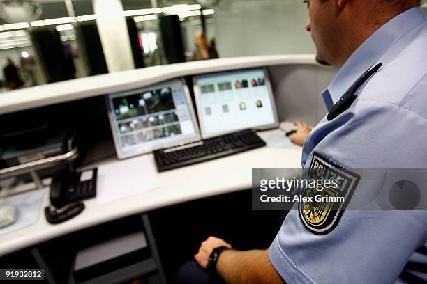 Federal police officer controles the passenger data during the presentation of the new automated border control system easyPass at Frankfurt...