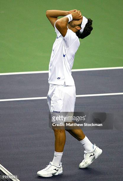Feliciano Lopez of Spain celebrates match point against Robin Soderling of Sweden during day six of the 2009 Shanghai ATP Masters 1000 at Qi Zhong...
