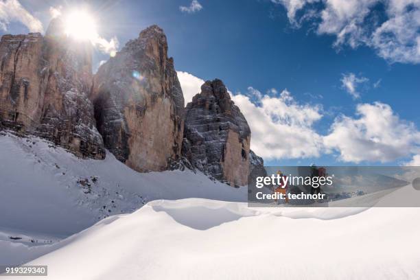 skiers touring around the cime in dolomites, italy - dolomites italy stock pictures, royalty-free photos & images