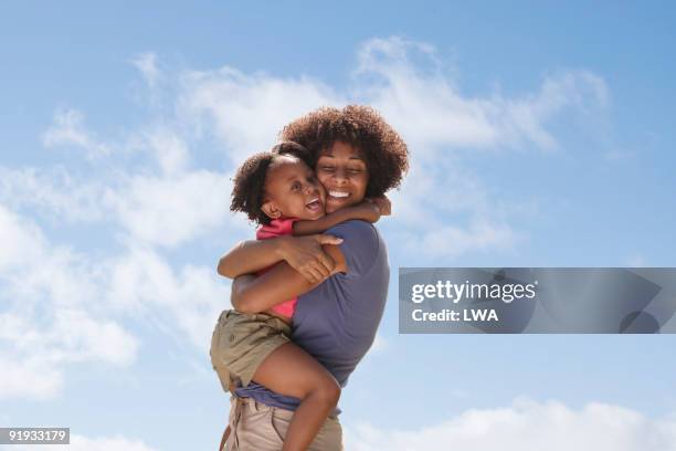 happy mother and daughter hugging - mother - fotografias e filmes do acervo