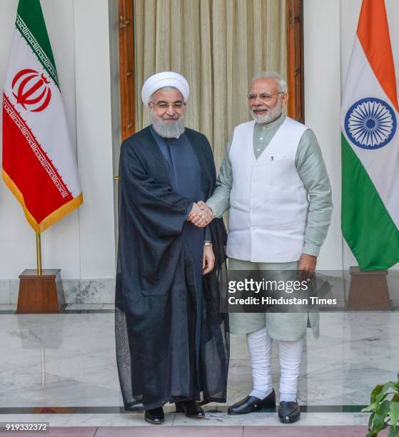 Iran President Dr. Hassan Rouhani shakes hands with PM Narendra Modi before business level talks at Hyderabad House, on February 17, 2018 in New...