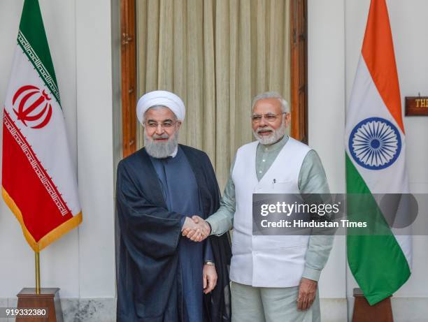 Iran President Dr. Hassan Rouhani shakes hands with PM Narendra Modi before business level talks at Hyderabad House, on February 17, 2018 in New...