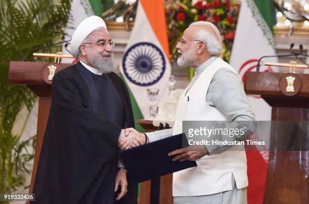 Iran President Dr. Hassan Rouhani with PM Narendra Modi after releasing commemorative stamp at Hyderabad House, on February 17, 2018 in New Delhi,...