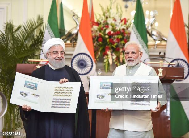 Iran President Dr. Hassan Rouhani with PM Narendra Modi releasing commemorative stamp at Hyderabad House, on February 17, 2018 in New Delhi, India....