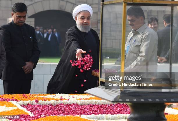 Iranian President Dr. Hassan Rouhani pays tribute to a memorial of Mahatma Gandhi at Rajghat, during his visit, on February 17, 2018 in New Delhi,...