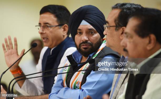Congress Leader Randeep Surjewala, Former BJP Leader Arvinder Singh Lovely, Congress Leader Ajay Maken and others during a press conference after...