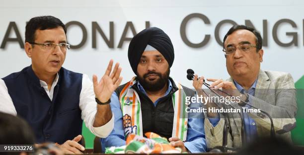 Congress Leader Randeep Surjewala, Former BJP Leader Arvinder Singh Lovely, Congress Leader Ajay Maken and others during a press conference after...