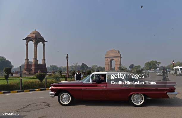 People participate during the 21 Gun Salute Vintage Car Rally at India Gate, on February 17, 2018 in New Delhi, India. Over 125 vintage cars & 35...