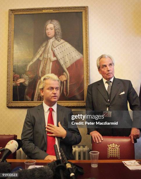 Right-wing Dutch MP Geert Wilders is watched by Lord Pearson as he speaks to reporters near Parliament on October 16, 2009 in London. Mr Wilders was...