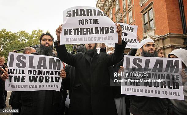 Protestors hold placards outside a press conference being held by right-wing Dutch MP Geert Wilders on October 16, 2009 in London. Mr Wilders was...