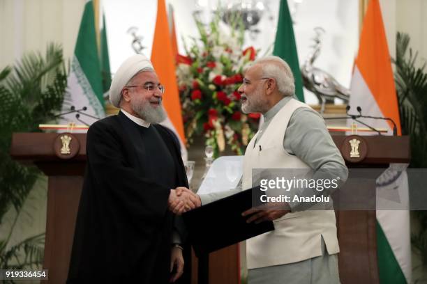 Indian Prime Minister Narendra Modi shakes hands with Iranian President Hassan Rouhani after signing a cooperation agreement between India and Iran...