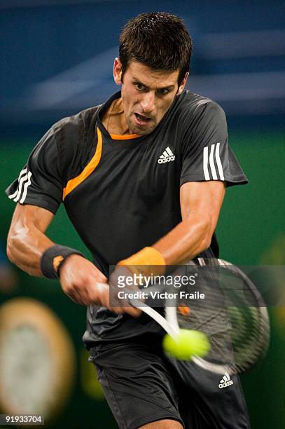 Novak Djokovic of Serbia returns a shot to Guilles Simon of France during day six of 2009 Shanghai ATP Masters 1000 at Qi Zhong Tennis Centre on...