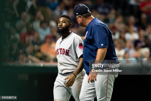 Jackie Bradley Jr. #19 of the Boston Red Sox walks off the field with manager John Farrell of the Boston Red Sox during the seventh inning against...