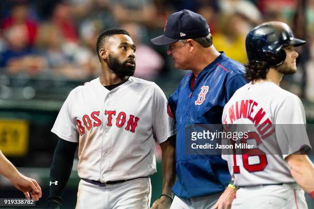 Jackie Bradley Jr. #19 of the Boston Red Sox walks off the field with manager John Farrell of the Boston Red Sox during the seventh inning against...