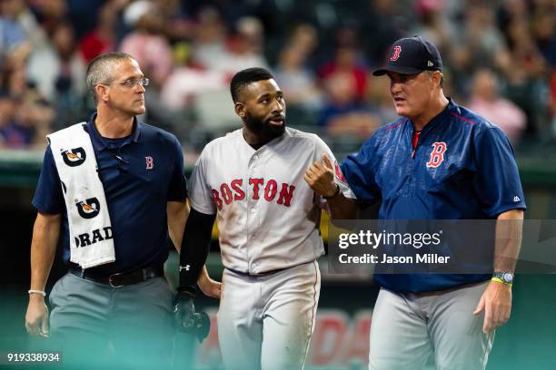 Jackie Bradley Jr. #19 of the Boston Red Sox walks off the field with manager John Farrell of the Boston Red Sox during the seventh inning against...