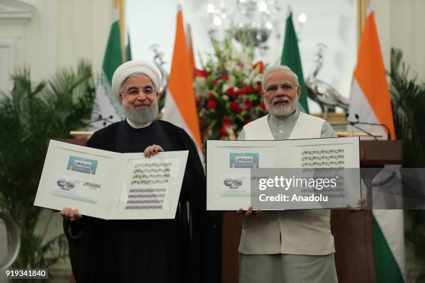 Indian Prime Minister Narendra Modi and Iranian President Hassan Rouhani pose for a photo after signing a cooperation agreement between India and...