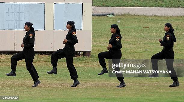 Women commandos of the National Security Guards display their skills during a function to celebrate the 25th NSG Raising day in Gurgaon, around 50...