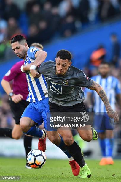 Brighton's Israeli midfielder Beram Kayal vies with Coventry City's English striker Jonson Clarke-Harris during the English FA Cup fifth round...