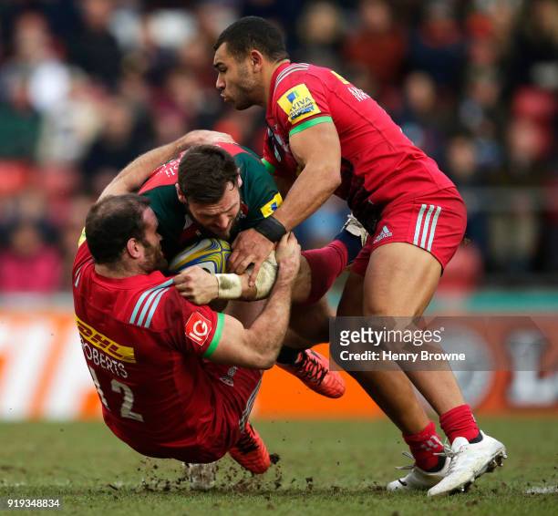 Adam Thompstone of Leicester Tigers tackled by Jamie Roberts and Joe Marchant of Harlequins during the Aviva Premiership match between Leicester...