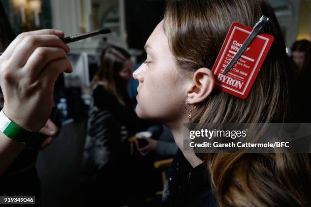 Model has makeup applied backstage ahead of the Jasper Conran show during London Fashion Week February 2018 at Claridges Hotel on February 17, 2018...