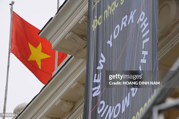 Banner advertising the visit to Hanoi by the New York Philharmonic orchestra hangs from the facade of Hanoi Opera House on October 16 with a...