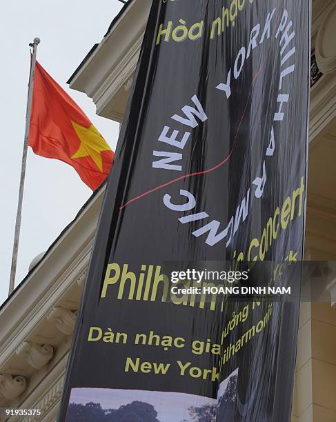Banner advertising the visit to Hanoi by the New York Philharmonic orchestra hangs from the facade of Hanoi Opera House on October 16 with a...