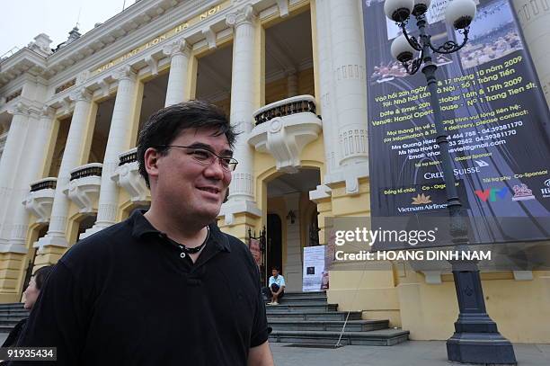 Music Director Alan Gilbert of the New York Philharmonic Orchestra walks in front of the Hanoi Opera House as he leaves after a rehearsal on October...