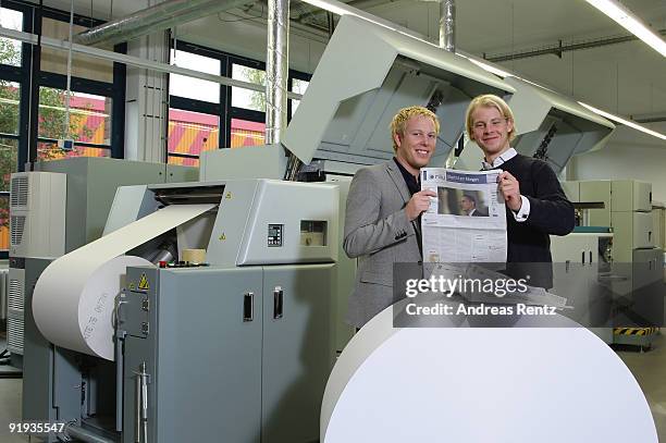 The two German entrepreneurs Wanja Soeren Oberhof and Hendrik Tiedemann of Niiu, the world's first individualised newspaper, stand in front of a...